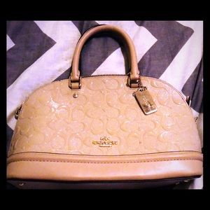 Nude Coach Embossed Patent Bag